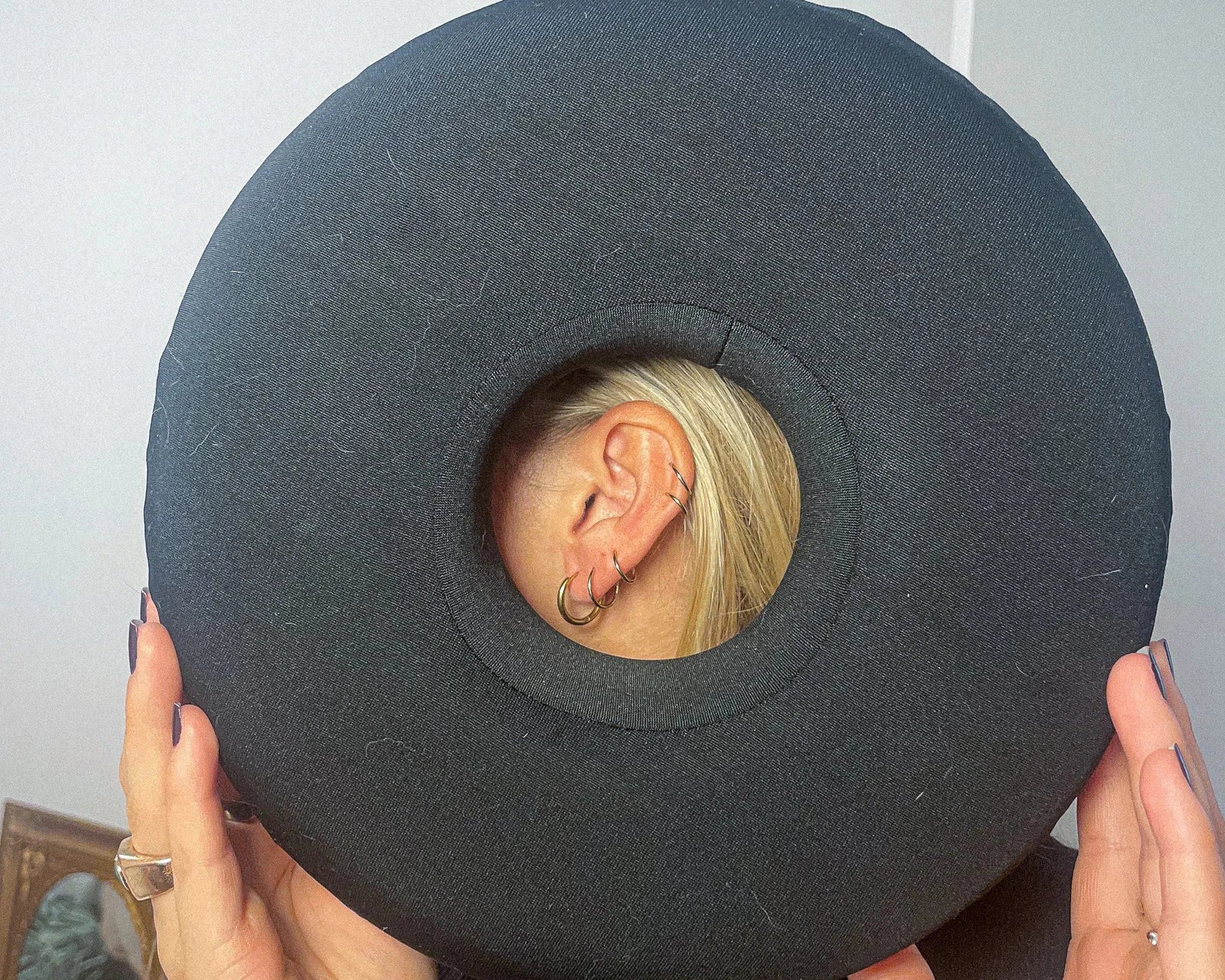 Person enjoying live music event with ear protection