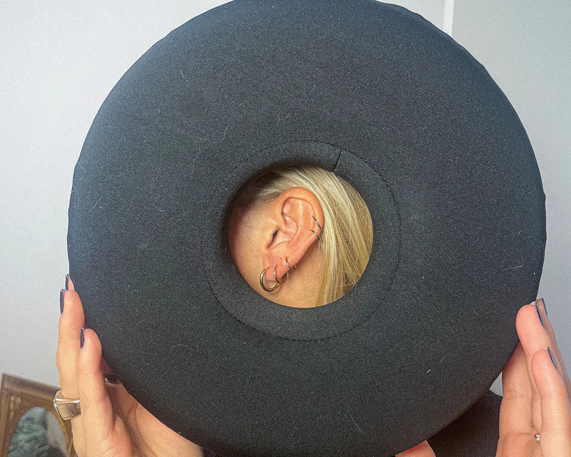 Person enjoying live music event with ear protection